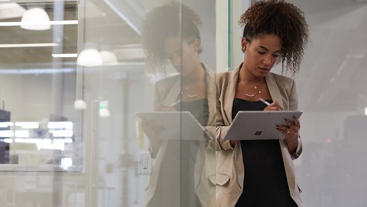 MSFT A woman writes with Surface Pen on a Surface tablet RWFO6s | Braintree