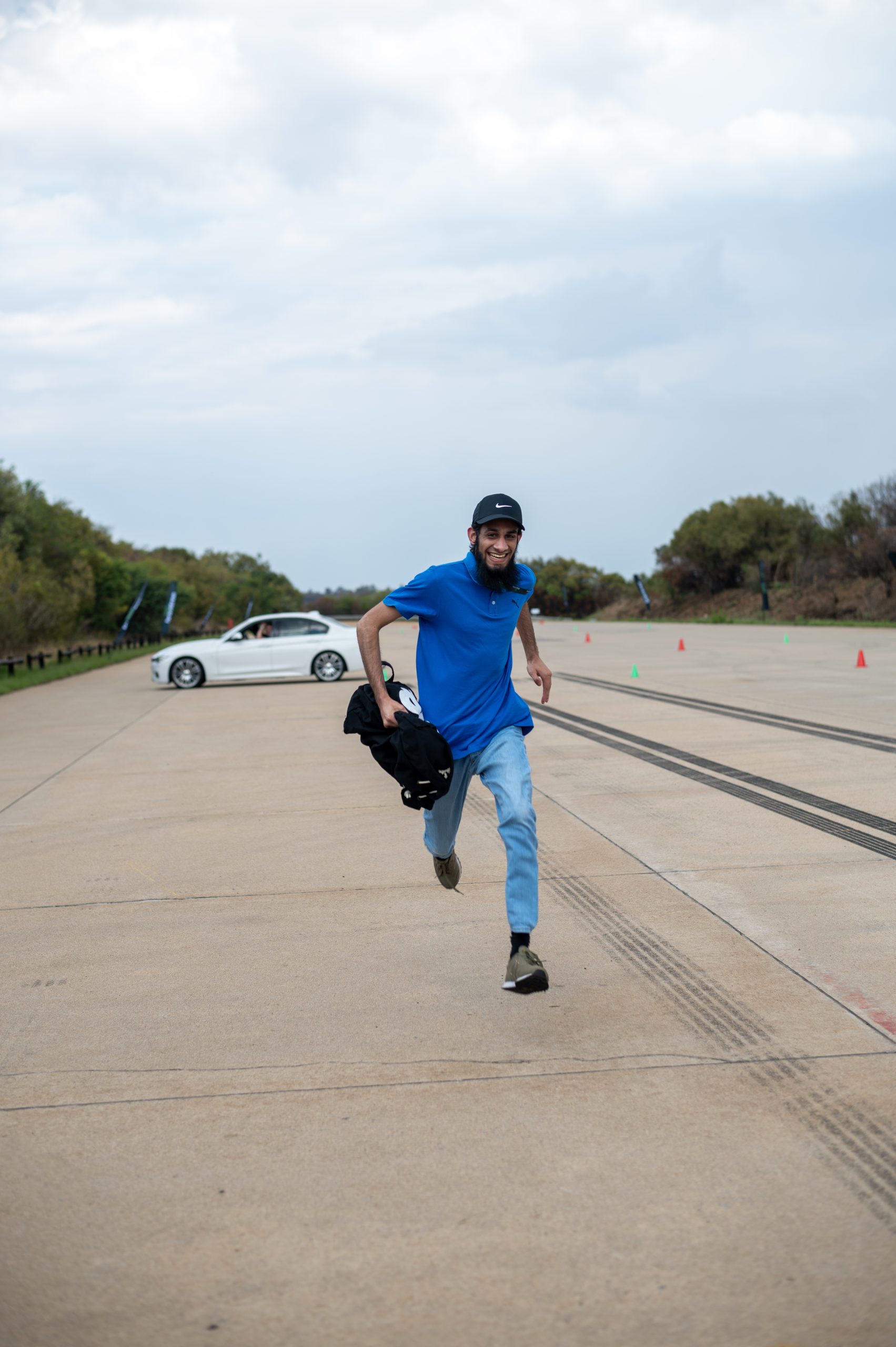 a Braintree employee running down a road - 12