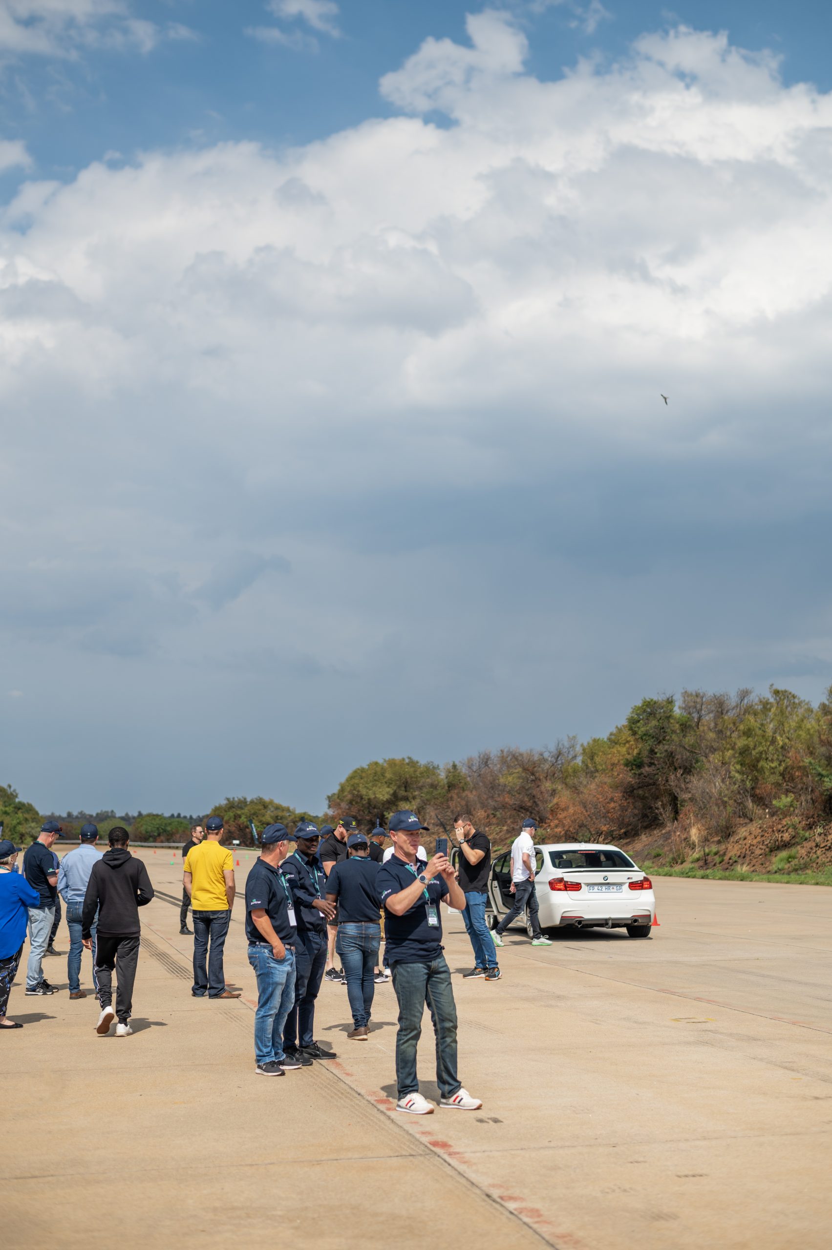 Braintree employees standing around on a road - 7