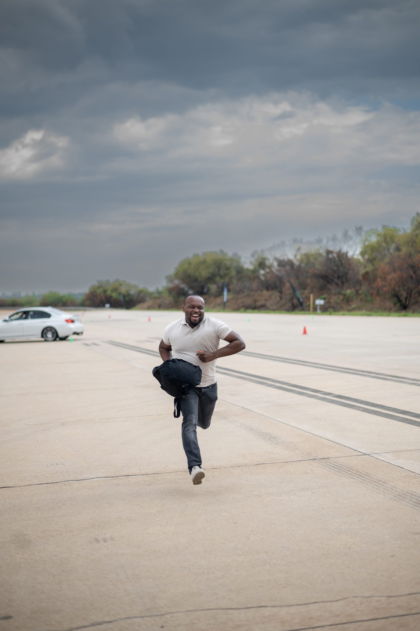 a Braintree employee running down a road.